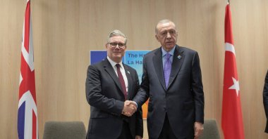 President Recep Tayyip Erdoğan (R) and Britain&#039;s Prime Minister Keir Starmer shake hands during a bilateral meeting at the NATO summit in The Hague, Netherlands, June 25, 2025. (Reuters Photo)