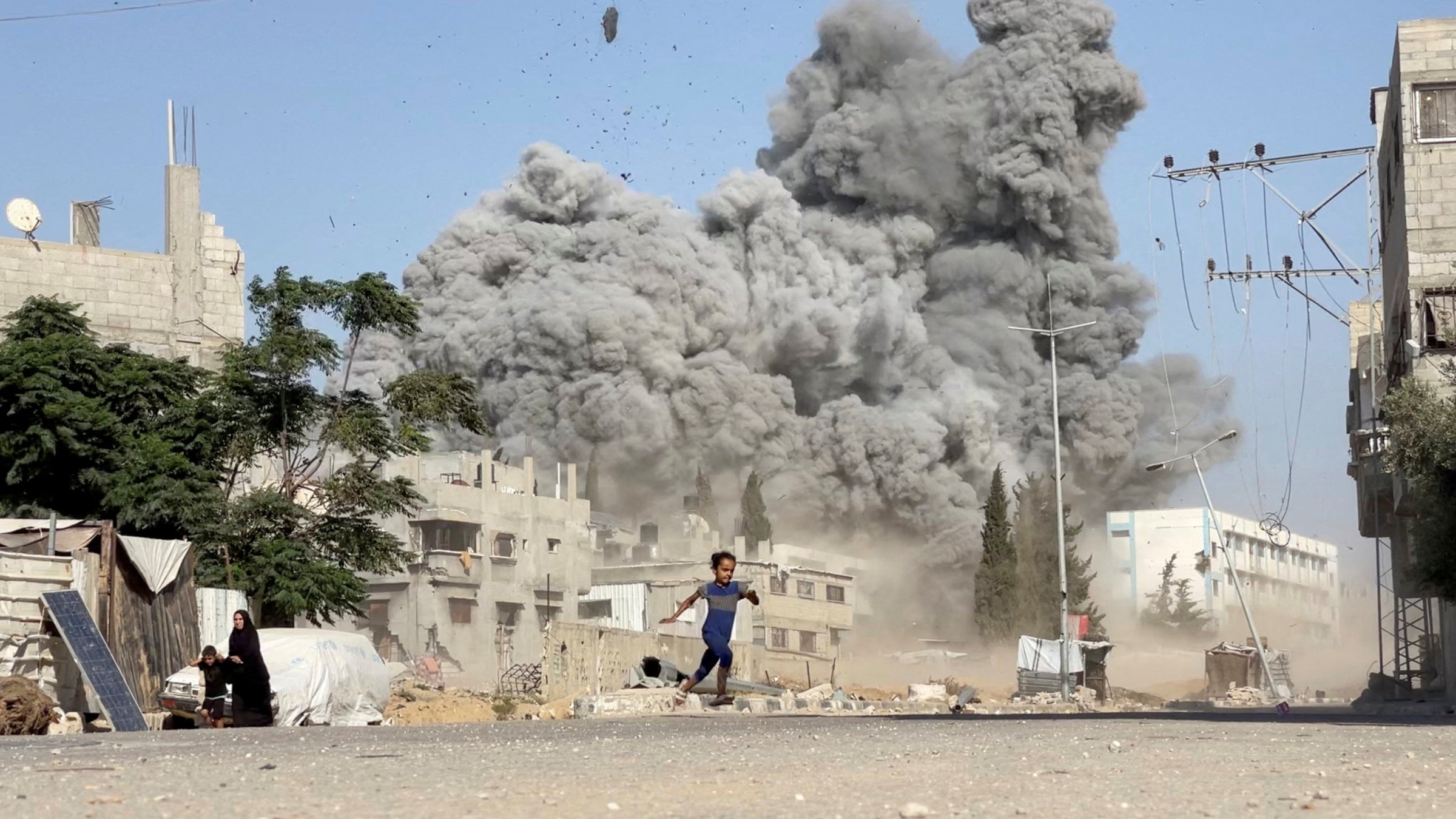 Israeli attacks kill 26 Palestinians near aid centers in Gaza