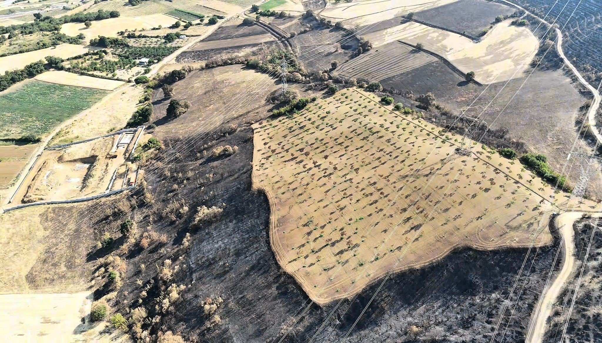 A scene of a village and a neighborhood that were reduced to ashes following a forest fire was captured from the air, Bilecik, Türkiye, July 19, 2025. (İHA Photo)