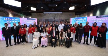 President Recep Tayyip Erdoğan poses with youth athletes, scientists and public health advocates during the tobacco control anniversary event, Istanbul, Türkiye, July 19, 2025. (AA Photo)