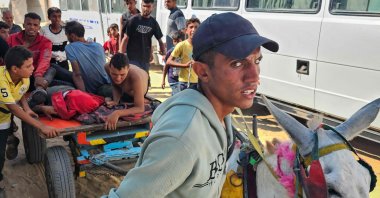 Palestinians transport people who were killed or injured while trying to get humanitarian aid, into the Red Cross field hospital in the Mawasi area of Rafah, southern Gaza Strip, Palestine, July 20, 2025. (AFP Photo)