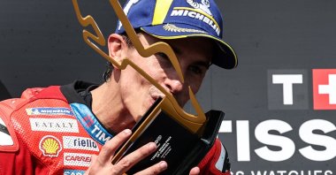 epa12249430 Ducati Lenovo Team rider Marc Marquez of Spain celebrates on the podium after winning the Moto GP race of  the Motorcycling Grand Prix of Czechia at the Automotodrom Brno racetrack in Brno, Czechia, 20 July 2025.  EPA/FILIP SINGER