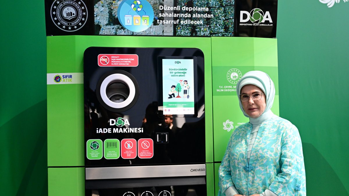First lady Emine Erdoğan poses next to a locally produced Deposit Packaging Returns (DOA) machine at the Environment Festival held by Ümraniye Municipality, Istanbul, Türkiye, July 18, 2025. (AA Photo)