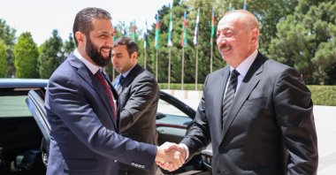 This handout picture, released by the Syrian Presidency, shows Azerbaijani President Ilham Aliyev (R) receiving Syria&#039;s interim President Ahmed al-Sharaa in Baku, Azerbaijan, July 12, 2025. (AFP Photo)