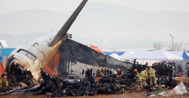 People work at the site where an aircraft went off the runway and crashed at Muan International Airport, Muan, South Korea, Dec. 30, 2024. (Reuters Photo)