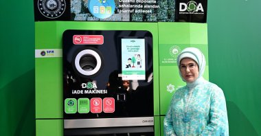 First lady Emine Erdoğan poses next to a locally produced Deposit Packaging Returns (DOA) machine at the Environment Festival held by Ümraniye Municipality, Istanbul, Türkiye, July 18, 2025. (AA Photo)