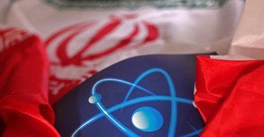 Atomic symbol and Iranian flag are seen in this illustration taken Sept. 8, 2022. (Reuters Photo)