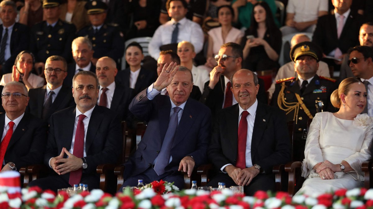President Recep Tayyip Erdoğan, Foreign Minister Hakan Fidan (L) and Turkish Cypriot leader Ersin Tatar attend a military parade commemorating Türkiye&#039;s 1974 liberation of Cyprus and the establishment of the Turkish Republic of Northern Cyprus (TRNC), Lefkoşa (Nicosia), TRNC, July 20, 2025. (AFP Photo)
