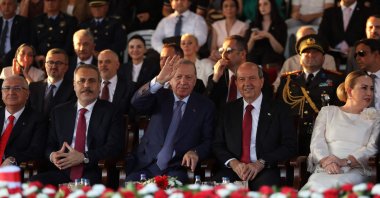 President Recep Tayyip Erdoğan, Foreign Minister Hakan Fidan (L) and Turkish Cypriot leader Ersin Tatar attend a military parade commemorating Türkiye's 1974 liberation of Cyprus and the establishment of the Turkish Republic of Northern Cyprus (TRNC), Lefkoşa (Nicosia), TRNC, July 20, 2025. (AFP Photo)