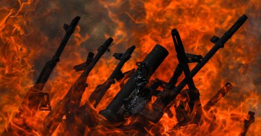 Weapons placed by PKK terrorists are burned during a disarmament ceremony, Sulaimaniya, Iraq, July 11, 2025. (AA Photo)