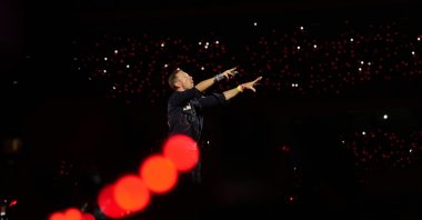 Chris Martin of Coldplay performs during the band&#039;s Music Of The Spheres World Tour, Navi Mumbai, India, Jan. 18, 2025. (AP Photo)