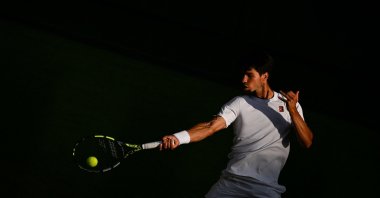 Spain's Carlos Alcaraz plays a forehand return to Italy's Jannik Sinner during their men's singles final tennis match in Wimbledon, London, U.K., July 13, 2025. (AFP Photo)