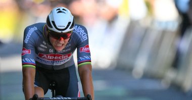 Dutch rider Mathieu van der Poel cycles to the finish line of the 11th stage of the Tour de France, in Toulouse, southwestern France, July 16, 2025. (AFP Photo)