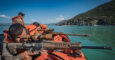 A sniper from the Turkish Armed Forces (TSK) prepares carefully in full ghillie suit camouflage ahead of the international competition, Isparta, Türkiye, June 11, 2025. (AA Photo)