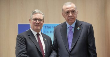 President Recep Tayyip Erdoğan (R) and Britain&#039;s Prime Minister Keir Starmer shake hands during a bilateral meeting at the NATO summit in The Hague, Netherlands, June 25, 2025. (Reuters Photo)