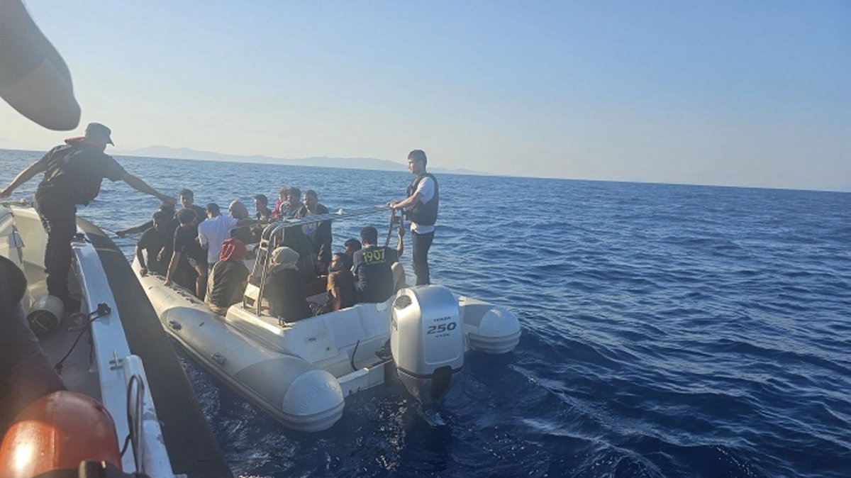 Coast guard forces rescue 33 irregular migrants off the coast of Izmir province, Türkiye, July 22, 2025 (AA Photo)