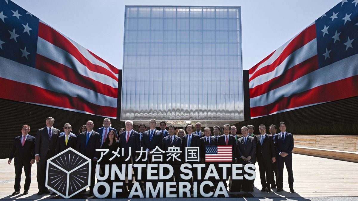 U.S. Treasury Secretary Scott Bessent (C-L) and Japan&#039;s Economic Revitalization Minister and chief trade negotiator Ryosei Akazawa (C-R) pose with a delegation in front of the USA Pavilion during a photo session after the USA National Day ceremony at the Osaka World Expo 2025, in Osaka, Japan, July 19, 2025. (EPA Photo)