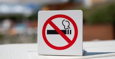 A non-smoking sign is displayed prominently at a public venue. (Shutterstock Photo)
