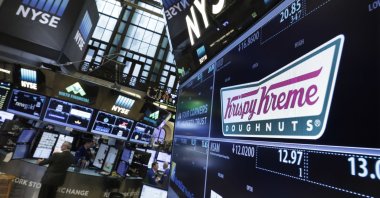 The Krispy Kreme logo appears above its trading post on the floor of the New York Stock Exchange, New York, U.S., May 9, 2016. (AP Photo)
