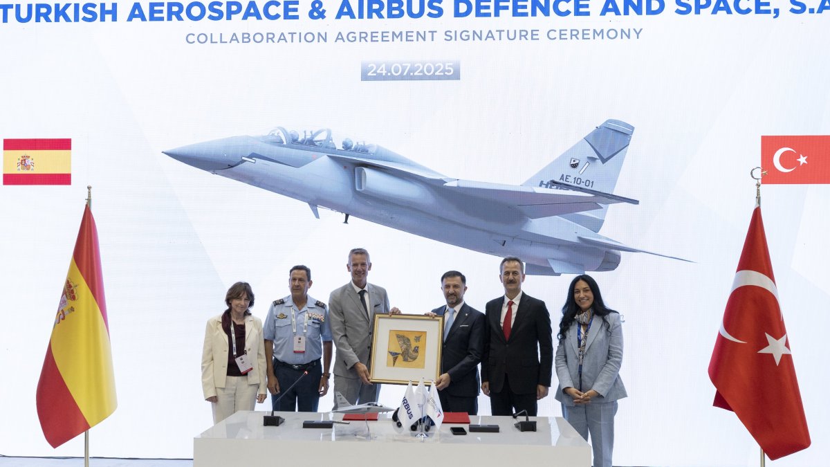Turkish Aerospace Industries (TAI), Airbus officials, along with the head of the Presidency of Defense Industries (SSB), Haluk Görgün (2R), are seen during a ceremony on the signing of a partnership to export jet trainer Hürjets, Istanbul, Türkiye, July 24, 2025. (AA Photo)
