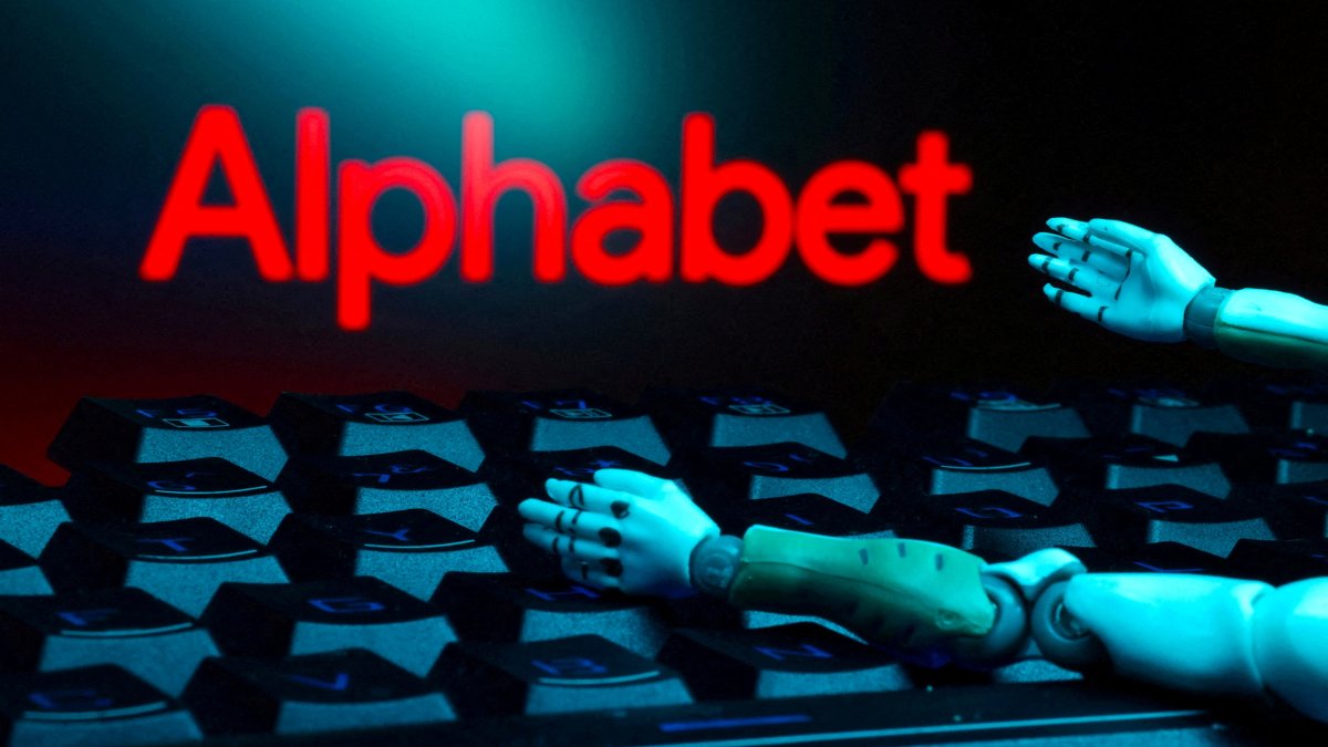 The Alphabet logo, a keyboard and robot hands are seen in this illustration created on Jan. 27, 2025. (Reuters Photo)