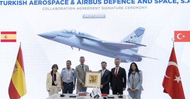 Turkish Aerospace Industries (TAI), Airbus officials, along with the head of the Presidency of Defense Industries (SSB), Haluk Görgün (2R), are seen during a ceremony on the signing of a partnership to export jet trainer Hürjets, Istanbul, Türkiye, July 24, 2025. (AA Photo)