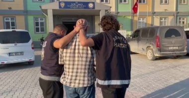 Police officers detain a suspect wanted for a 1984 murder in Germany during a coordinated operation, Hatay, Türkiye, July 24, 2025. (IHA Photo)