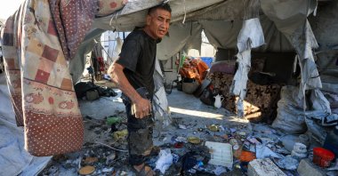 A Palestinian man inspects the damage at the site of an overnight Israeli strike on a tent sheltering displaced people, in Gaza City, central Gaza, Palestine, July 24, 2025. (Reuters Photo)