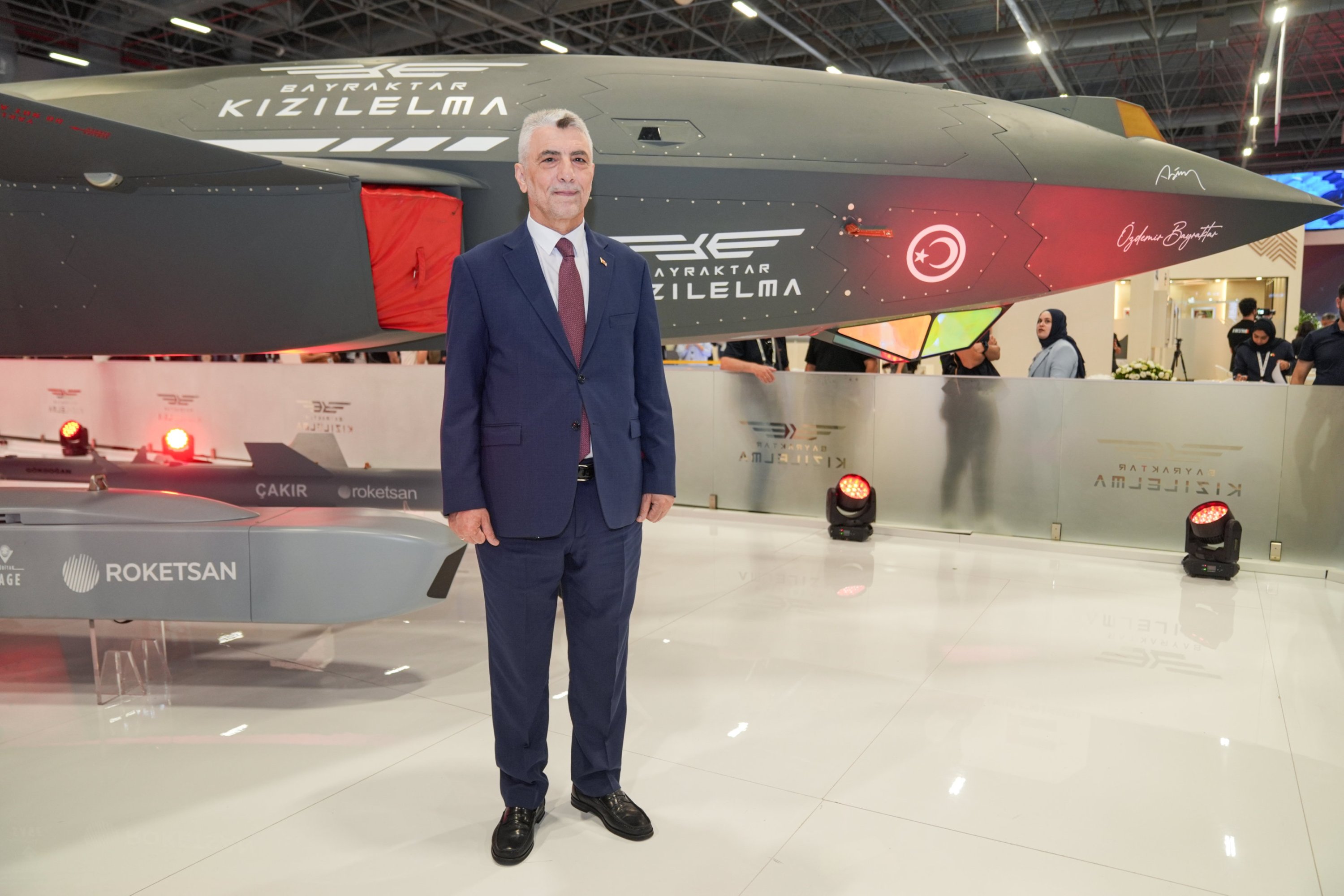 Trade Minister Ömer Bolat poses for a photo in front of Baykar's unmanned fighter jet Kızılelma during the International Defence Industry Fair (IDEF) in Istanbul, Türkiye, July 25, 2025. (AA Photo)