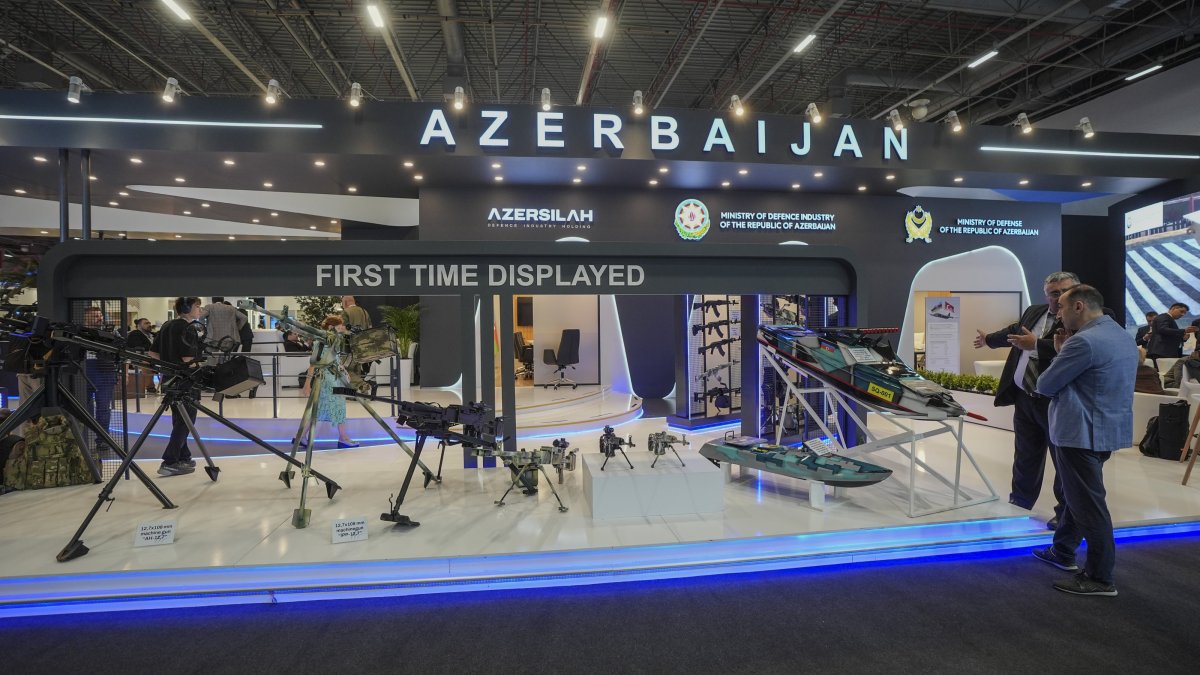 People stand by Azerbaijan&#039;s national pavilion at the International Defense Industry Fair (IDEF) 2025, Istanbul, Türkiye, July 24, 2025. (AA Photo)