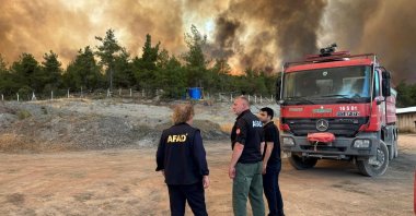 A photo shared by the Disaster and Emergency Management Authority (AFAD) shows personnel in front of ongoing forest fires, Türkiye, July 25, 2025 (AA Photo)
