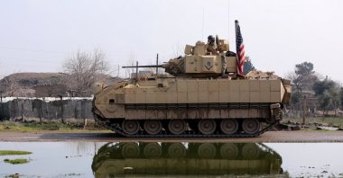 A U.S. military vehicle drives during a joint U.S.-YPG patrol in the countryside of Qamishli, northeastern Syria, Feb. 8, 2024. (Reuters Photo)
