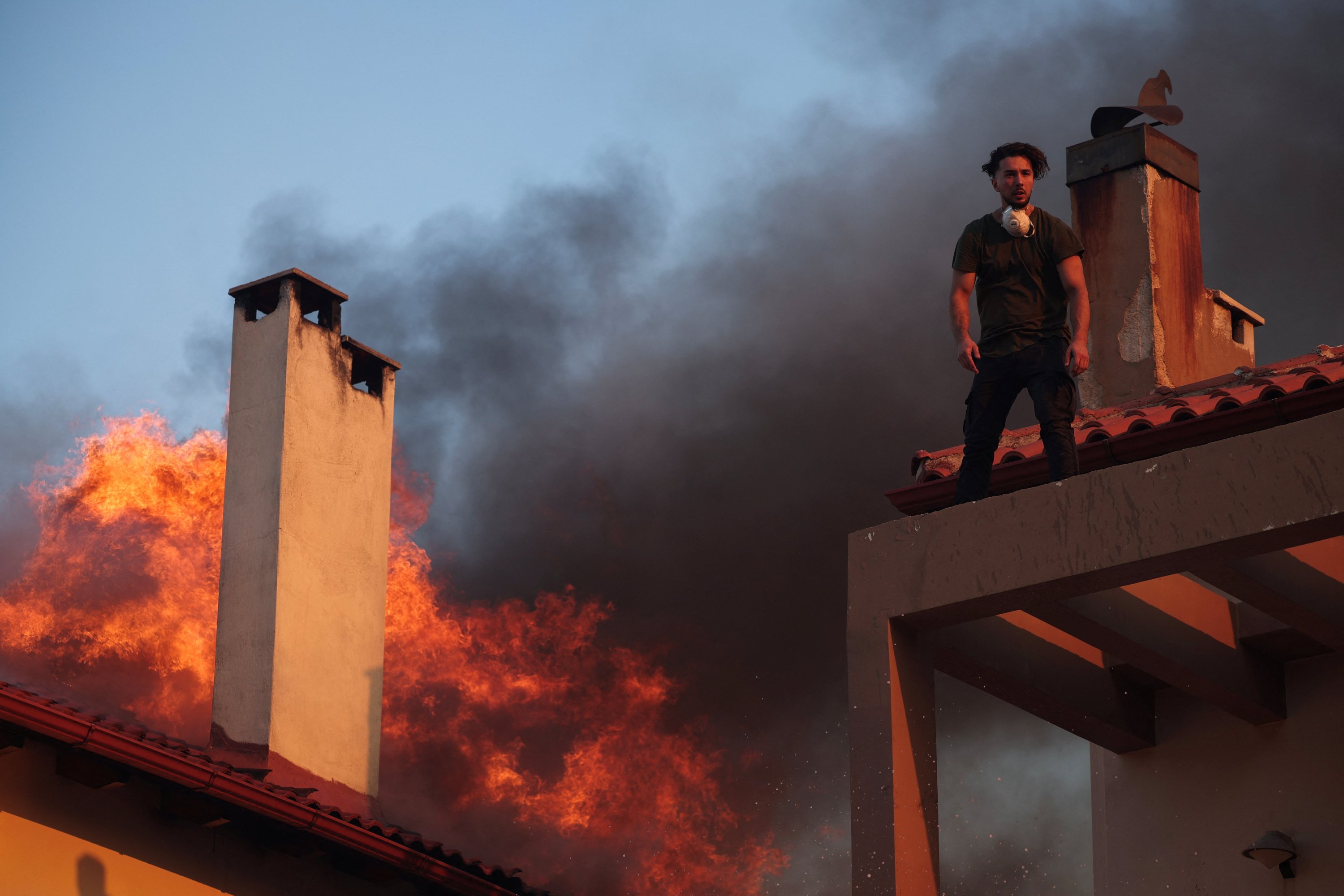 Greece struggles as heat wave fans raging nationwide wildfires