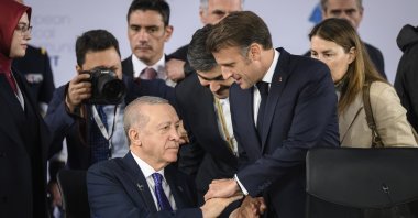 President Recep Tayyip Erdoğan talks with President Emmanuel Macron (R) ahead of a summit in Tirana, Albania, May 16, 2025. (AP Photo)