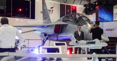 People take photos during the International Defense Industry Fair (IDEF), Istanbul, Türkiye, July 22, 2025. (EPA Photo)