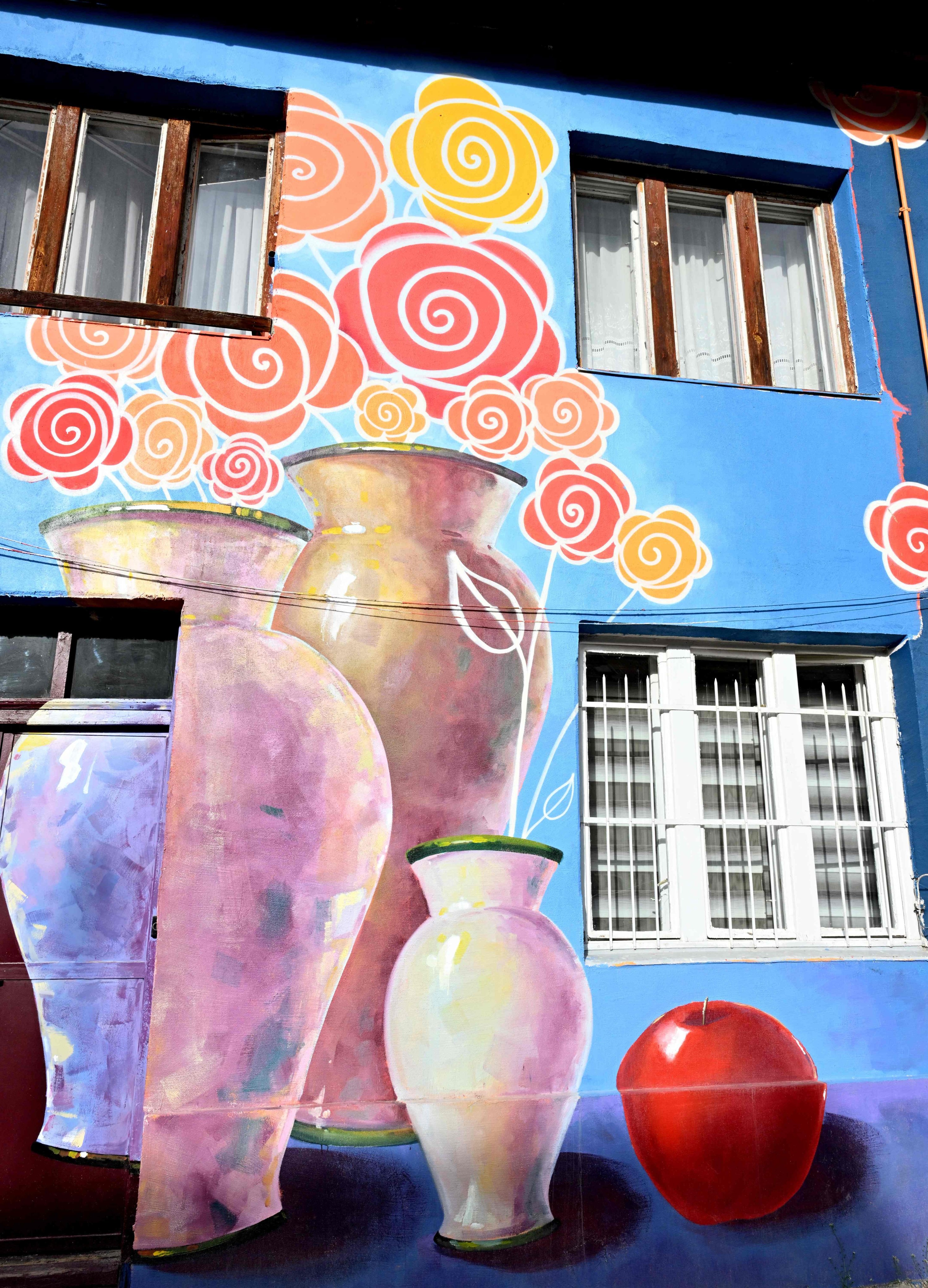The facades of old buildings renovated with murals by Bosnian street artist Benjamin Cengic and his creative team, Sarajevo, Bosnia-Herzegovina, May 22, 2025. (AFP Photo)