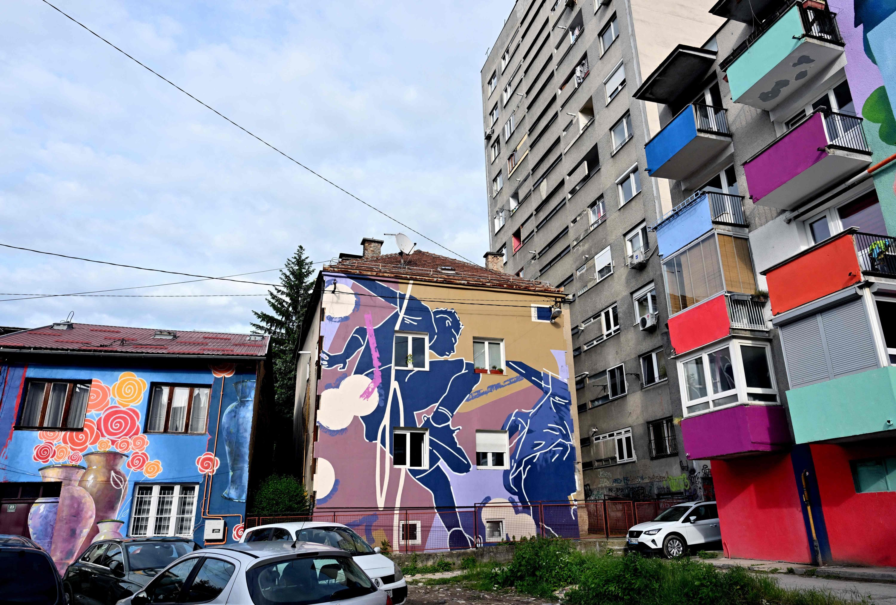 Facades of old buildings renovated with murals by Bosnian street artist Benjamin Cengic and his creative team, Sarajevo, Bosnia-Herzegovina, May 22, 2025. (AFP Photo)