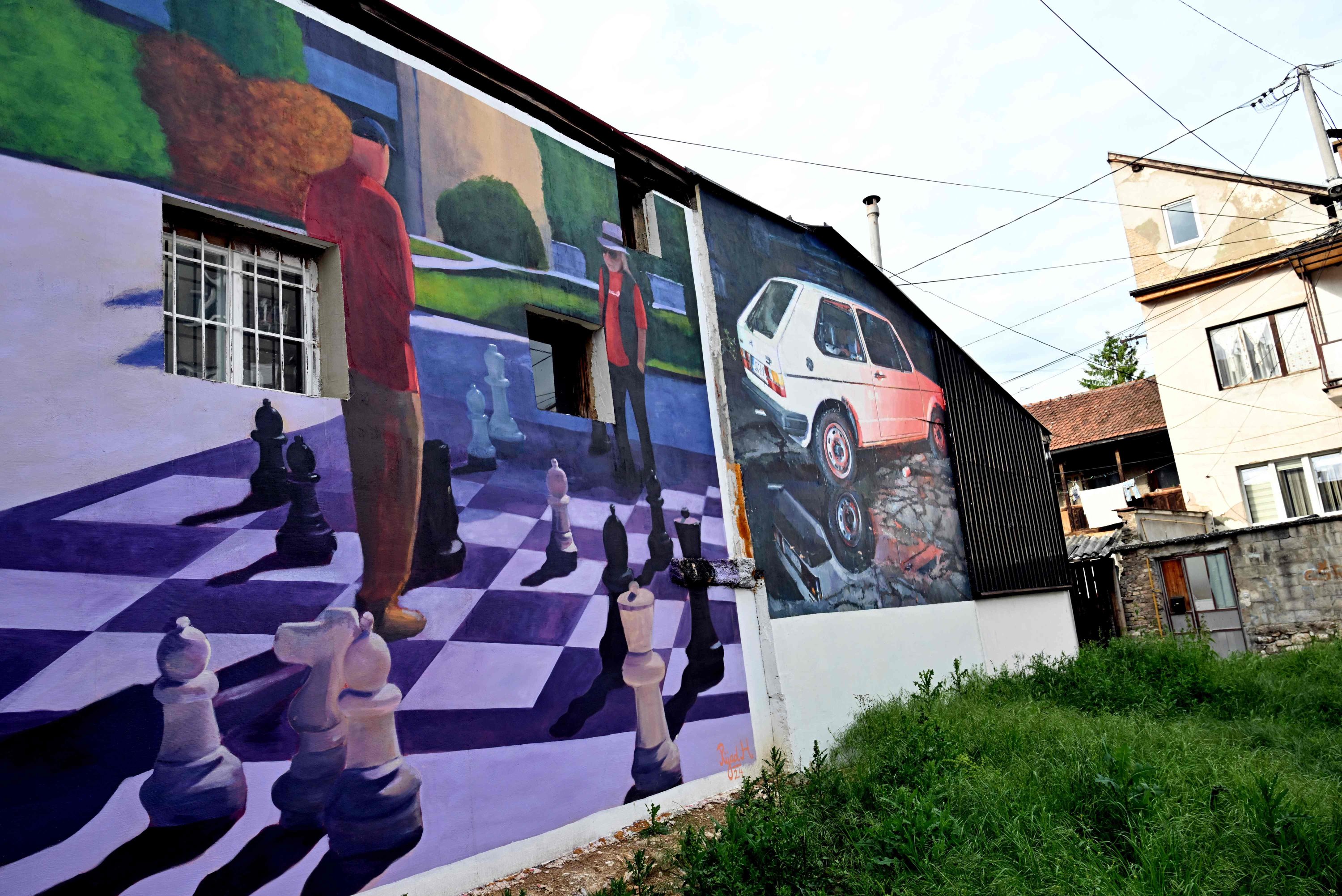 Facades of old buildings renovated with murals by Bosnian street artist Benjamin Cengic and his creative team, Sarajevo, Bosnia-Herzegovina, May 22, 2025. (AFP Photo)