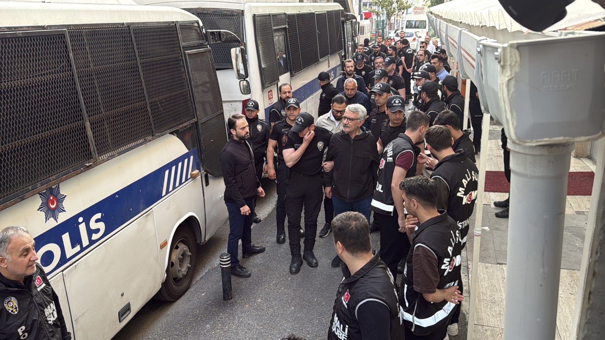 Police officers escort suspects detained in an investigation into corruption at Istanbul municipalities, Istanbul, Türkiye, June 3, 2025. (İHA Photo)