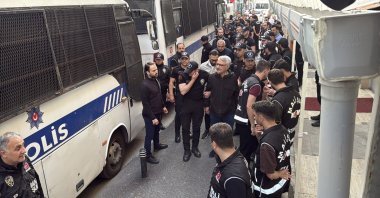 Police officers escort suspects detained in an investigation into corruption at Istanbul municipalities, Istanbul, Türkiye, June 3, 2025. (İHA Photo)