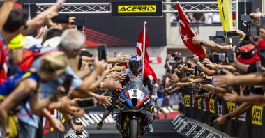 Turkish rider Toprak Razgatlıoğlu celebrates after winning the 2025 FIM Superbike World Championship (WorldSBK) at the Balaton Park Circuit, Balatonfokajar, Hungary, July 26, 2025. (AA Photo)