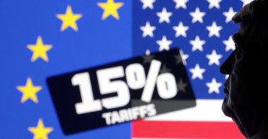 A 3D-printed miniature of U.S. President Donald Trump, U.S. and EU flags and the words &quot;15% tariffs&quot; are seen in this illustration taken July 27, 2025. (Reuters Photo)