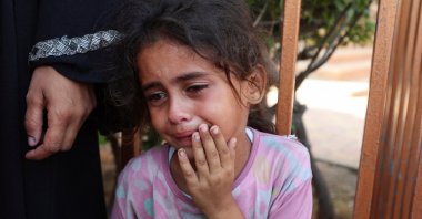A child reacts during the funeral of Palestinians killed in an overnight Israeli strike, in Khan Younis, southern Gaza Strip, Palestine, July 28, 2025. (Reuters Photo)
