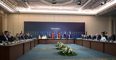Members of delegations from Ukraine (L), Russia (R) and Türkiye (C) attend the third round of talks between Russia and Ukraine, Istanbul, Türkiye, July 23, 2025. (AFP Photo)