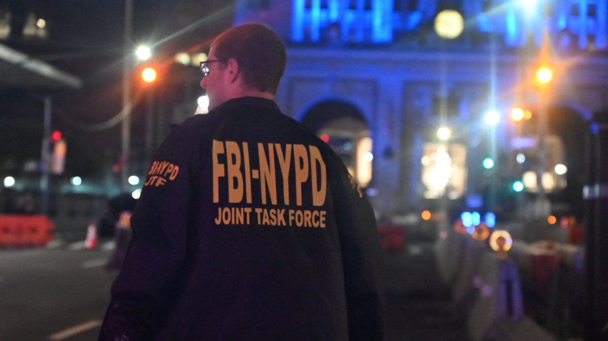 A member of the FBI-NYPD joint task force inspects the scene of a mass shooting in New York, U.S., July 28, 2025. (AA Photo)