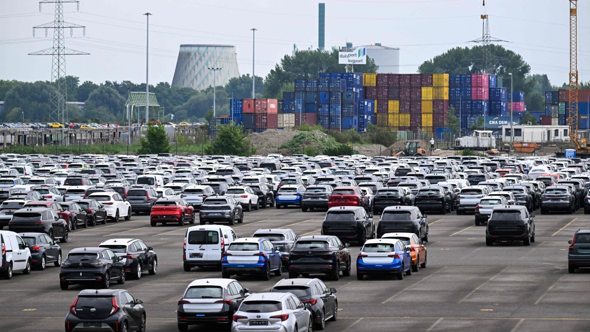 Cars stand ready for export at a parking lot of the Duisburg harbour, western Germany, July 14, 2025. (AFP Photo)