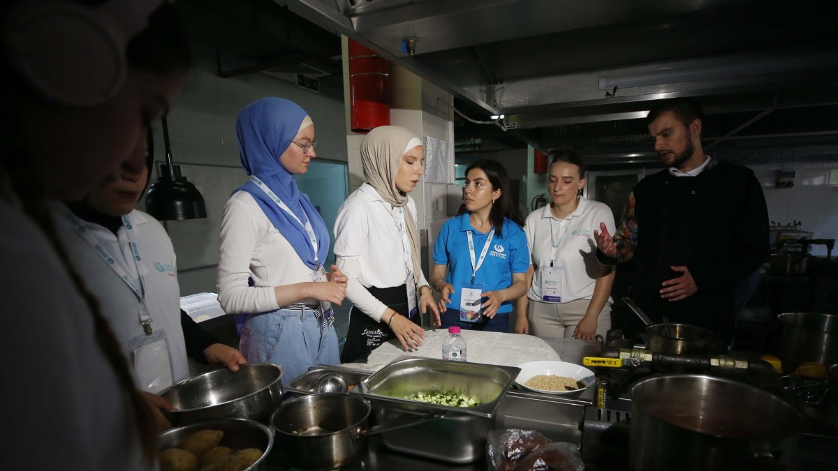 International students prepare traditional dishes from their home countries during a gastronomy workshop at Çanakkale March 18 University, Türkiye, July 29, 2025. (AA Photo)