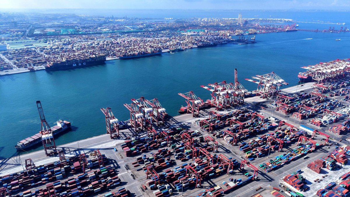 Containers and ships are seen at the port in Qingdao, China’s eastern Shandong province, July 28, 2025. (AFP Photo)
