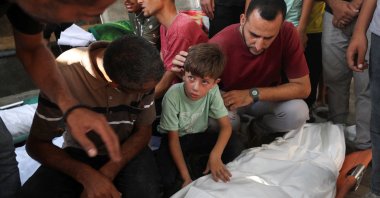 Mourners react next to a body during the funeral of Palestinians killed by Israeli fire at Al-Shifa Hospital in Gaza City, central Gaza, Palestine, July 29, 2025. (Reuters Photo)