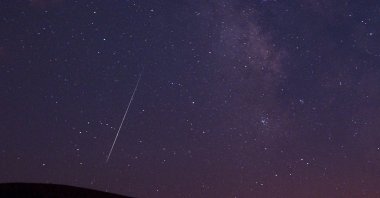 A Perseid meteor streaks across the sky during the Perseid meteor shower in Vinton, California, U.S., Aug. 11, 2009. (AP Photo)